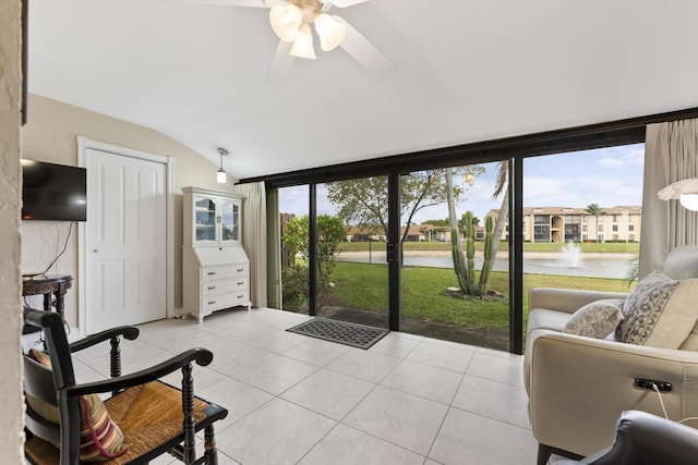 sunroom / solarium featuring lofted ceiling and a ceiling fan