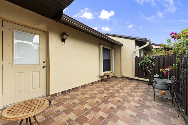 view of patio featuring fence