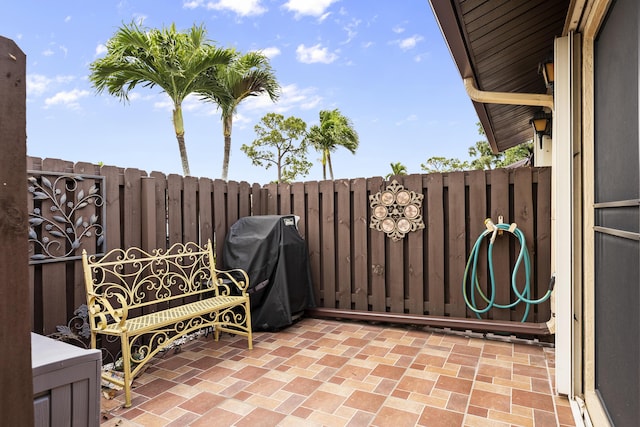 view of patio featuring fence