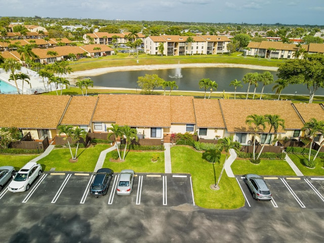 birds eye view of property with a residential view and a water view