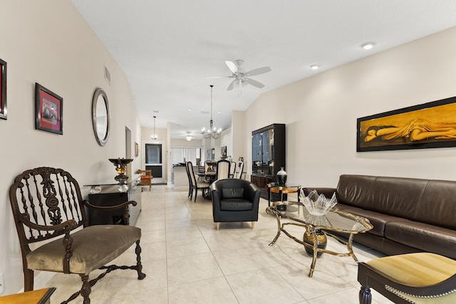 living room featuring light tile patterned floors, ceiling fan with notable chandelier, visible vents, and high vaulted ceiling