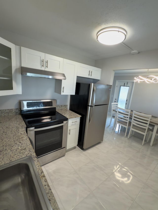 kitchen featuring under cabinet range hood, white cabinets, light stone countertops, and appliances with stainless steel finishes