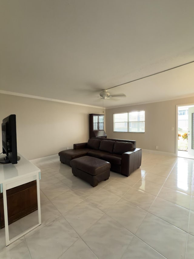 living room featuring crown molding and ceiling fan