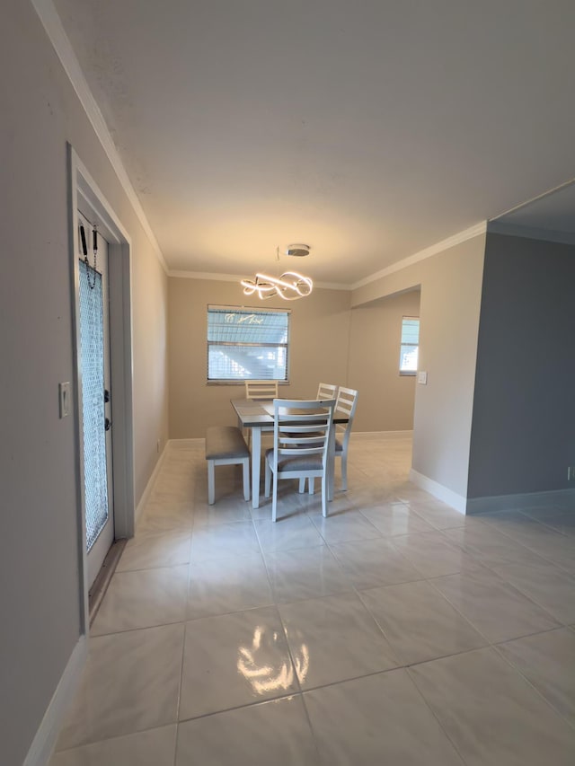 dining area with a notable chandelier, light tile patterned floors, baseboards, and ornamental molding