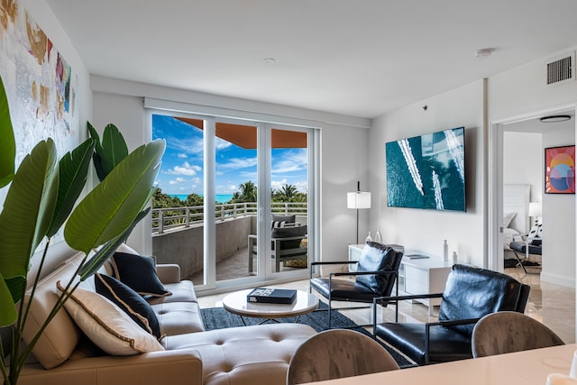 living area featuring visible vents and baseboards