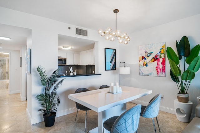 dining area featuring baseboards and visible vents