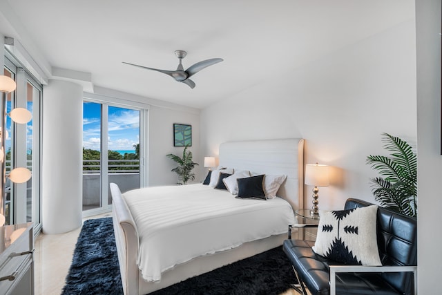 bedroom featuring ceiling fan and access to exterior