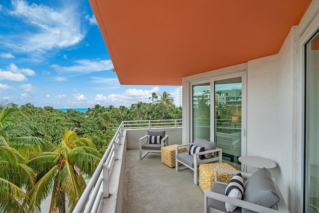 balcony featuring a water view