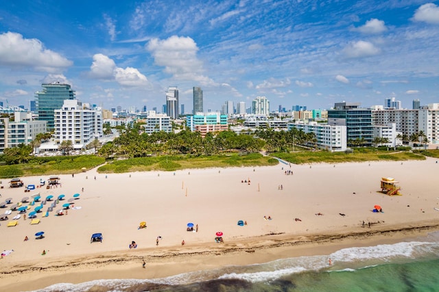 bird's eye view featuring a city view, a beach view, and a water view