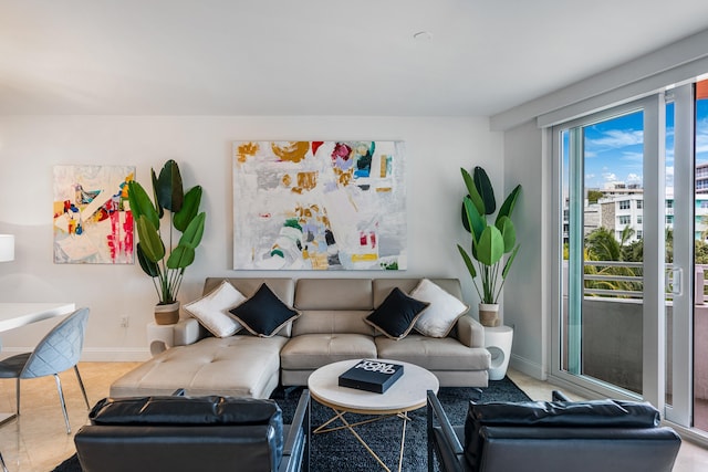 living area featuring baseboards