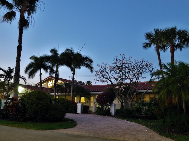 2601 NE 37th St, Fort Lauderdale, FL 33306 - view of front facade with a gate and decorative driveway