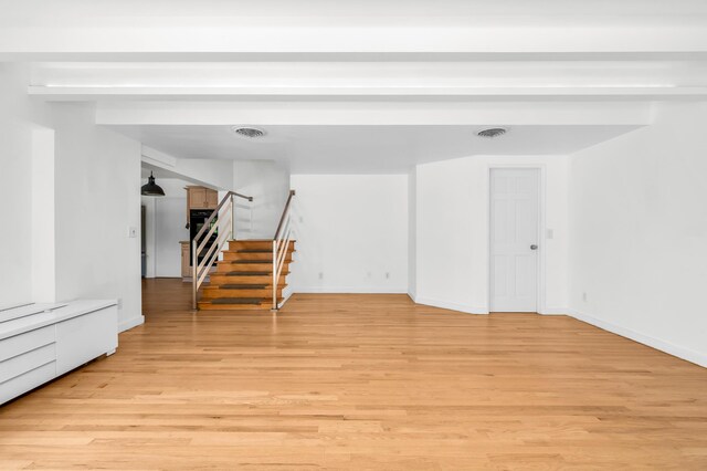2601 NE 37th St, Fort Lauderdale, FL 33306 - unfurnished room with light wood-style floors, stairway, and baseboards