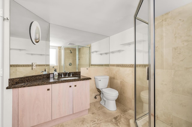 2601 NE 37th St, Fort Lauderdale, FL 33306 - bathroom featuring tile walls, toilet, a stall shower, and vanity