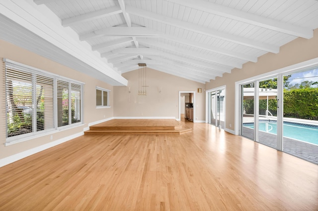 2601 NE 37th St, Fort Lauderdale, FL 33306 - unfurnished living room with baseboards, light wood-type flooring, and a chandelier