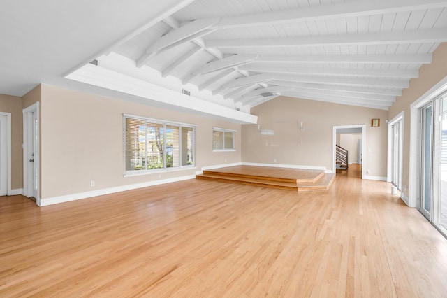 2601 NE 37th St, Fort Lauderdale, FL 33306 - unfurnished living room with plenty of natural light, light wood-style floors, stairs, and baseboards