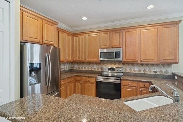 kitchen with dark stone countertops, backsplash, appliances with stainless steel finishes, and a sink