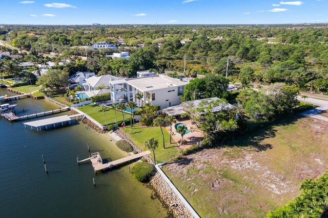 dock area featuring a lawn and a water view