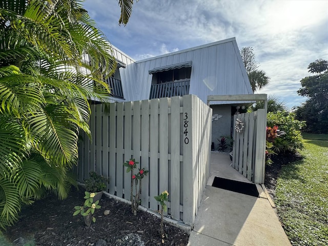 view of outbuilding with fence