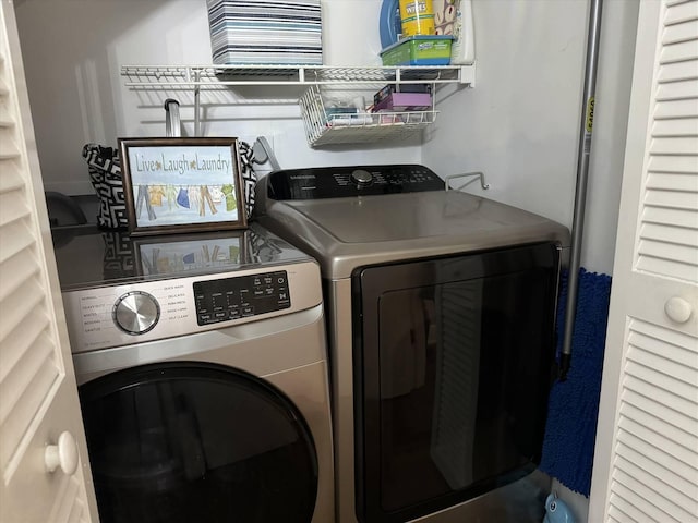 laundry room featuring independent washer and dryer and laundry area