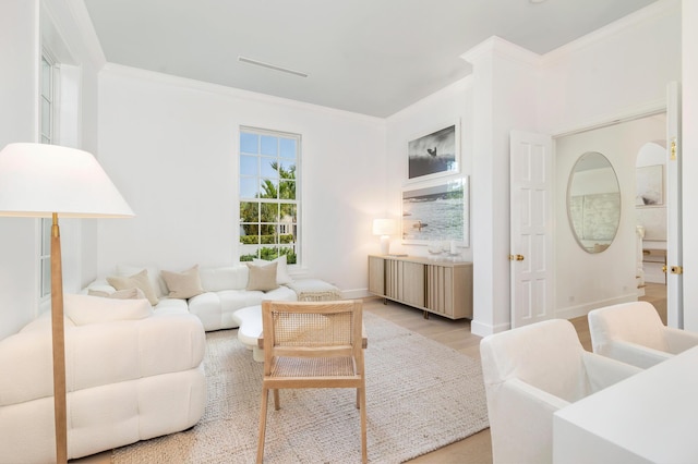 205 Gray St, West Palm Beach, FL 33405 - living area with light wood-style flooring and crown molding