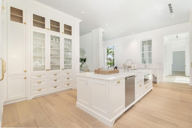 205 Gray St, West Palm Beach, FL 33405 - kitchen featuring dishwasher, ornamental molding, light wood-type flooring, white cabinets, and recessed lighting