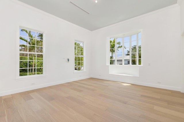 205 Gray St, West Palm Beach, FL 33405 - empty room featuring light wood finished floors and ornamental molding