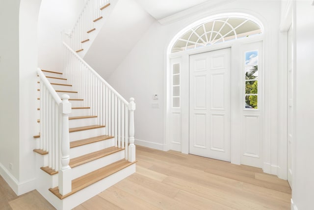 205 Gray St, West Palm Beach, FL 33405 - entrance foyer with light wood finished floors and stairway
