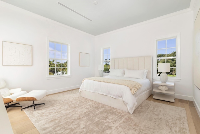 205 Gray St, West Palm Beach, FL 33405 - bedroom featuring wood finished floors, multiple windows, and ornamental molding