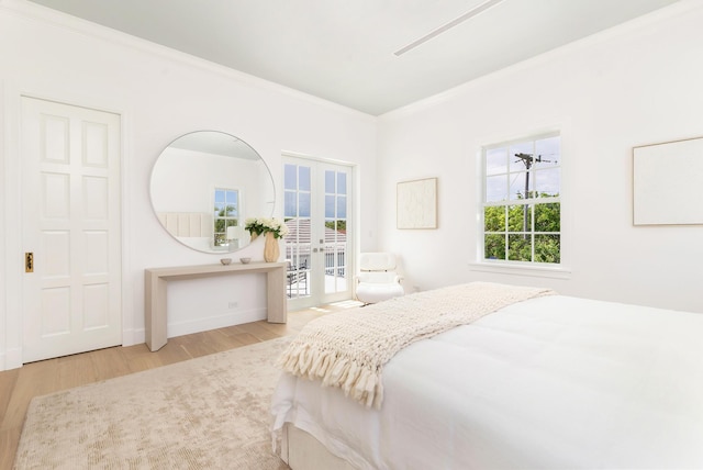 205 Gray St, West Palm Beach, FL 33405 - bedroom with crown molding, wood finished floors, access to exterior, and french doors