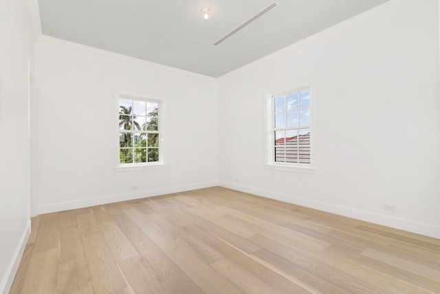 205 Gray St, West Palm Beach, FL 33405 - unfurnished room featuring crown molding, light wood finished floors, and healthy amount of natural light