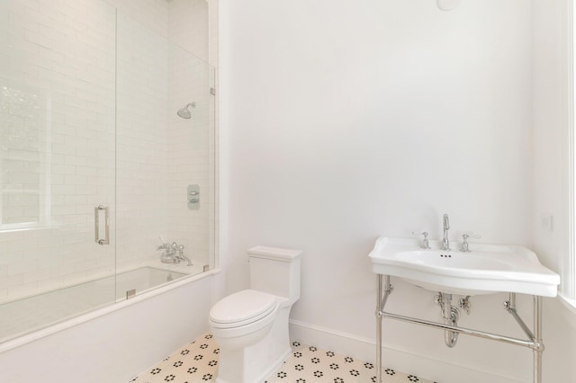 205 Gray St, West Palm Beach, FL 33405 - bathroom with combined bath / shower with glass door and tile patterned floors