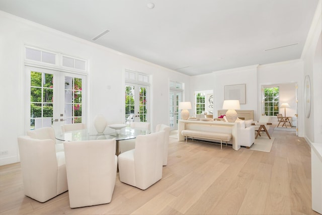 205 Gray St, West Palm Beach, FL 33405 - dining room featuring french doors, light wood-style floors, and crown molding