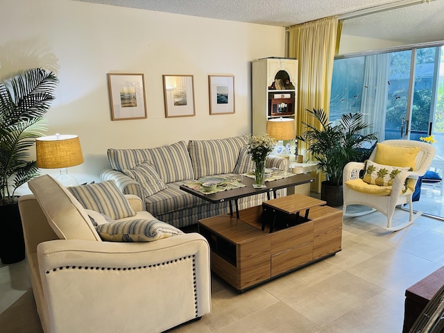 living room featuring a wall of windows and a textured ceiling