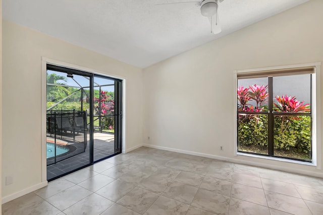 empty room with baseboards and a ceiling fan