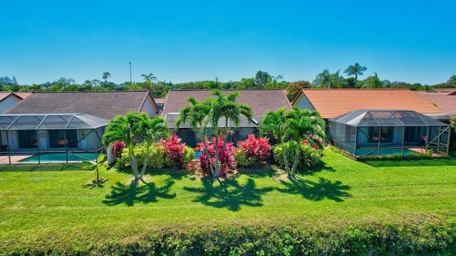 view of yard featuring an outdoor pool and a lanai