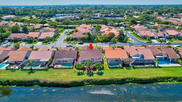 bird's eye view with a residential view and a water view