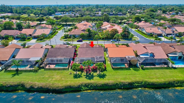 bird's eye view with a residential view and a water view