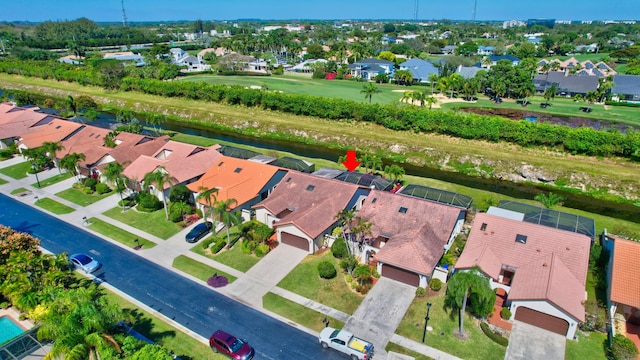 bird's eye view featuring a residential view and a water view