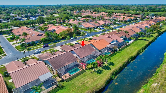 birds eye view of property with a residential view and a water view