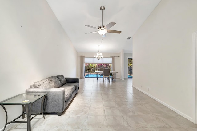 living area with visible vents, ceiling fan with notable chandelier, high vaulted ceiling, and baseboards