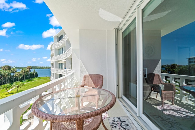 balcony featuring a water view