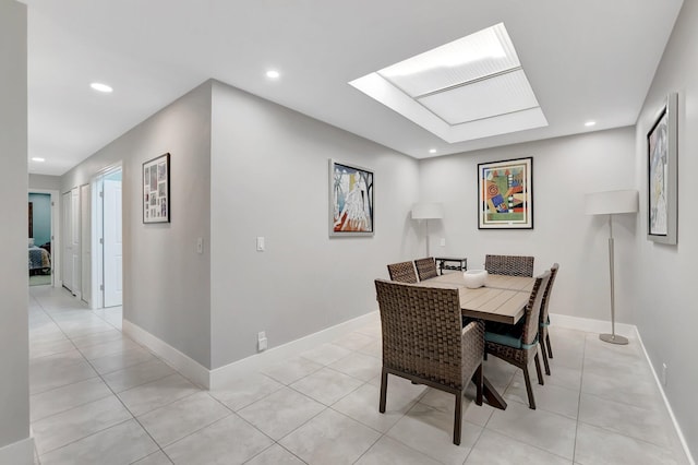 dining area featuring light tile patterned floors, recessed lighting, and baseboards