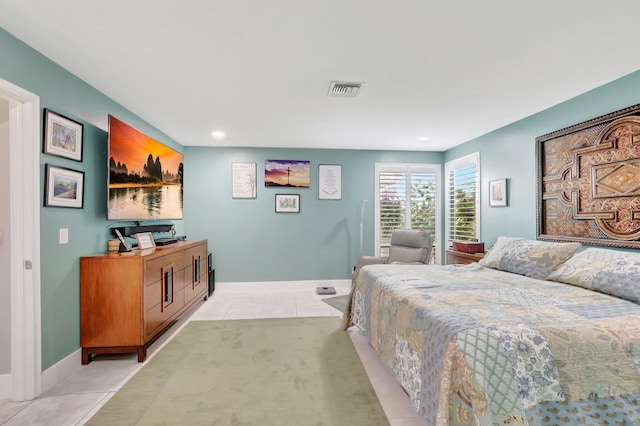 bedroom featuring light tile patterned floors, visible vents, recessed lighting, and baseboards