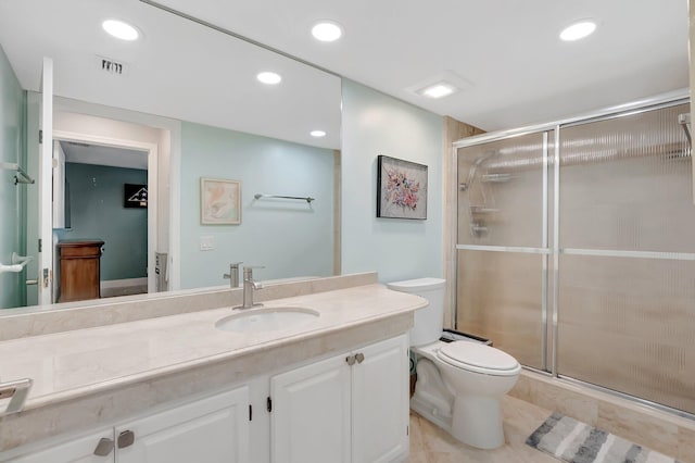 bathroom with visible vents, a shower stall, toilet, recessed lighting, and vanity