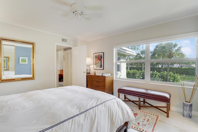 bedroom with visible vents and ceiling fan