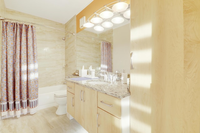 bathroom with shower / bath combination with curtain, toilet, and vanity