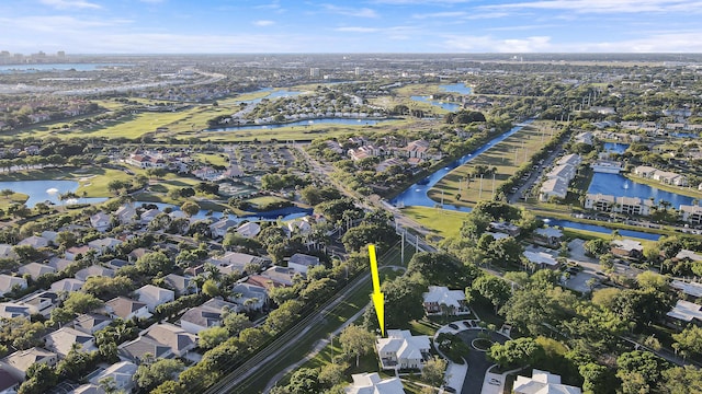 drone / aerial view featuring a residential view and a water view