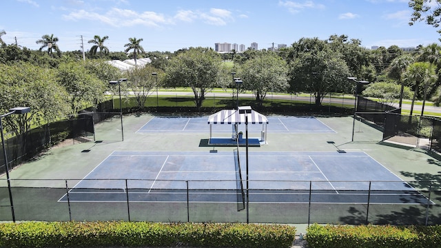 view of sport court featuring fence