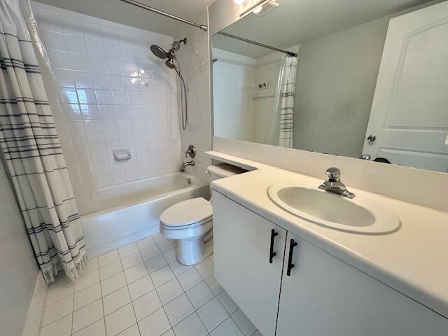 7896 Sonoma Springs Cir Unit 204, Lake Worth, FL 33463 - full bath with tile patterned floors, shower / bath combination with curtain, toilet, and vanity