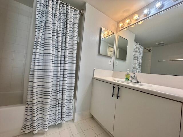 7896 Sonoma Springs Cir Unit 204, Lake Worth, FL 33463 - bathroom with visible vents, shower / tub combo with curtain, vanity, and tile patterned flooring